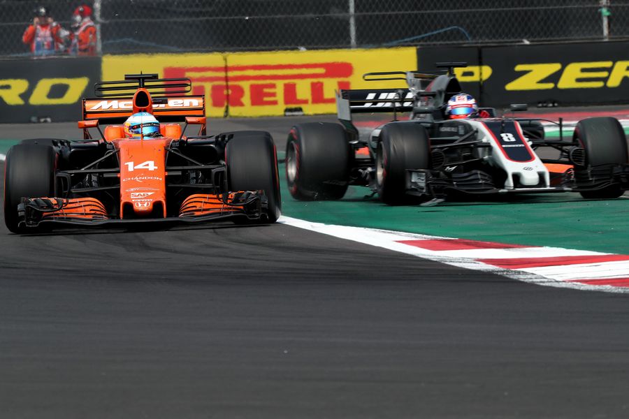 Fernando Alonso and Romain Grosjean battle