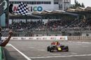 Race winner Max Verstappen takes the chequered flag