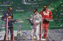 Max Verstappen, Valtteri Bottas and Kimi Raikkonen celebrate on the podium with the champagne