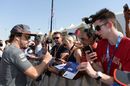 Fernando Alonso signs autographs for the fans