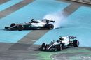 Race winner Valtteri Bottas and Lewis Hamilton perform donuts