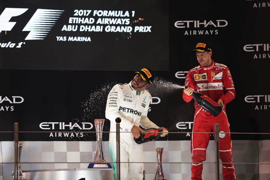 Lewis Hamilton and Sebastian Vettel celebrate on the podium