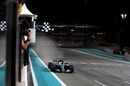 Race winner Valtteri Bottas crosses the line to take the chequered flag and win the race