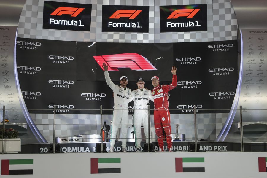 Top 3 drivers celebrate on the podium