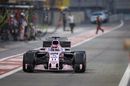 Sergio Perez powers down the pit lane in the Force India