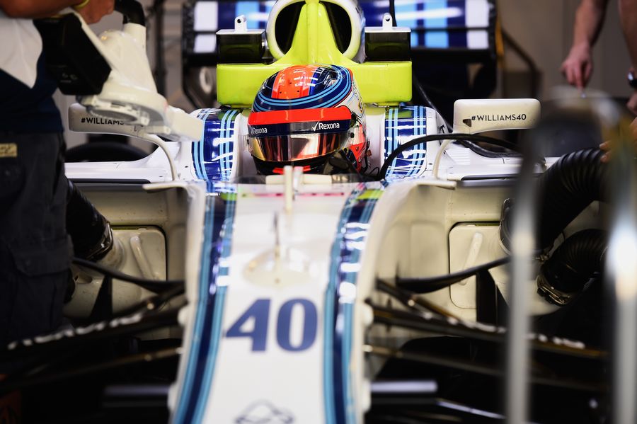 Robert Kubica sit in the Williams cockpit