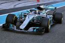 Valtteri Bottas powers down the pit lane in the Mercedes