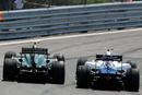 Heikki Kovalainen and Rubens Barrichello go wheel-to-wheel