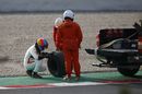 Fernando Alonso in the gravel with missing rear wheel