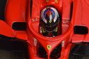 Kimi Raikkonen sits in the Ferrari cockpit