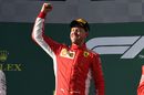 Race winner Sebastian Vettel celebrates on the podium