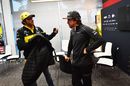 Carlos Sainz jr talks with the Fernando Alonso