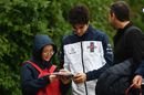 Lance Stroll signs autographs for the fans