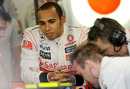A relaxed Lewis Hamilton in the McLaren pits