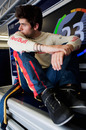 A patient Jaime Alguersuari waits in the Toro Rosso garage