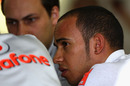 A pensive Lewis Hamilton in the McLaren pits