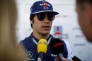 Lance Stroll talks with the media