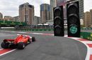 Kimi Raikkonen heads down the pit lane in the Ferrari