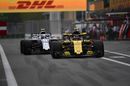 Carlos Sainz jr powers down the pit lane in the Renault