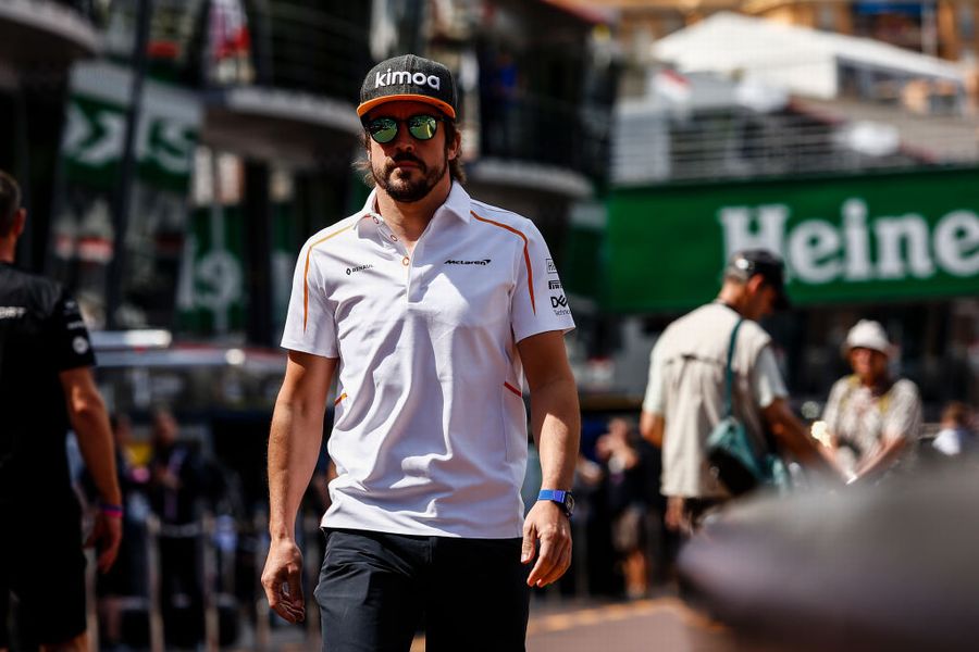 Fernando Alonso walks the pit lane