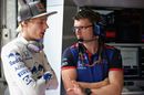 Brendon Hartley talks with engineer in the garage