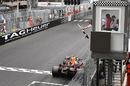Race winner Daniel Ricciardo crosses the line and takes the chequered flag