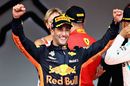Race winner Daniel Ricciardo celebrates on the podium
