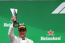 Valtteri Bottas celebrates on the podium with the trophy