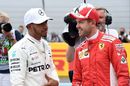 Lewis Hamilton talks with  Sebastian Vettel in parc ferme