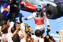 Jenson Button celebrates finishing third