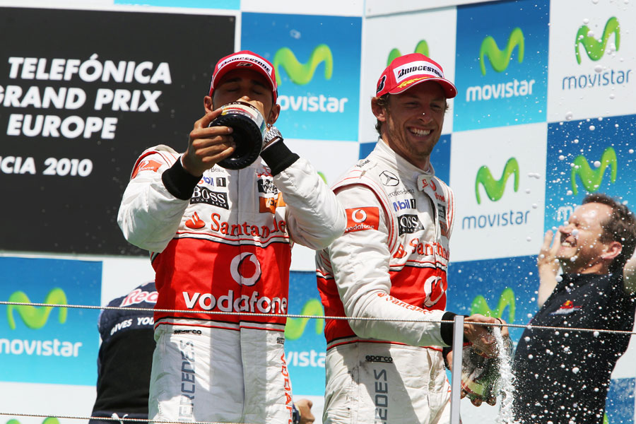 Lewis Hamilton and Jenson Button celebrate finishing second and third