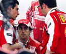 Fernando Alonso talks with Ferrari team boss Stefano Domenicali