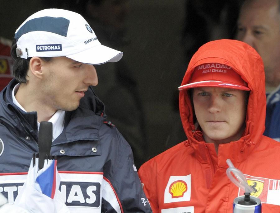 Kimi Raikkonen chats to Robert Kubica before the drivers' parade for the Chinese Grand Prix