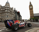 Mark Webber drives round Parliament Square at the crack of dawn