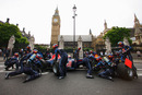 Mark Webber completes a pit stop outside the Houses of Parliament