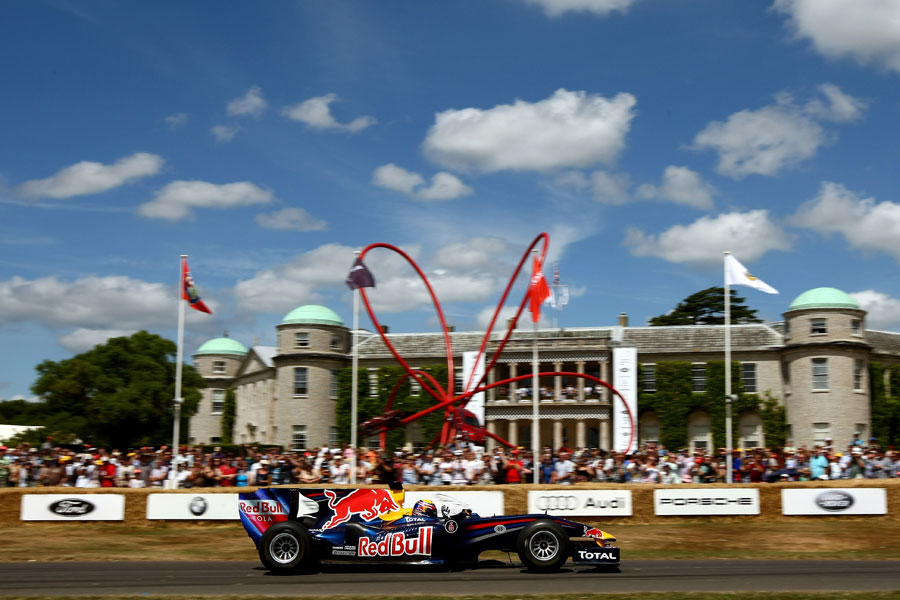 Mark Webber drives the Red Bull Racing RB1 Demo Car up the hill 