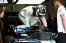 Valtteri Bottas climbs into his car in the garage