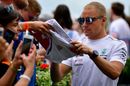 Valtteri Bottas signs autographs for the fans