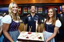 Daniel Ricciardo is presented with a birthday cake to celebrate his 29th birthday