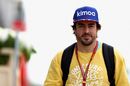 Fernando Alonso walks through the paddock