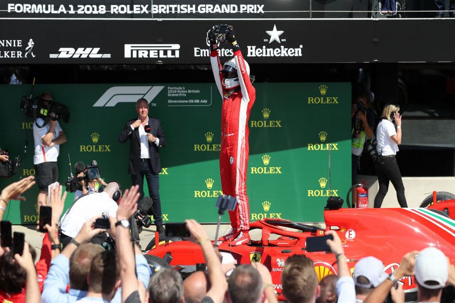 Race winner Sebastian Vettel cerebrates on the palc ferme