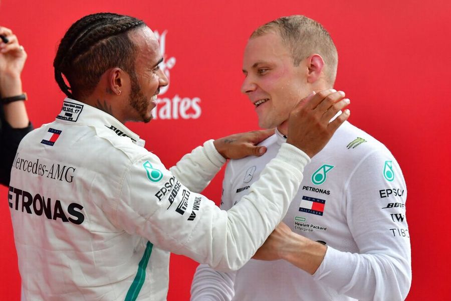 Race winner Lewis Hamilton and Valtteri Bottas celebrate in parc ferme