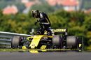 Nico Hulkenberg climbs from his car after stopping on track