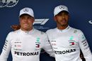 Pole sitter Lewis Hamilton and Valtteri Bottas celebrates in parc ferme