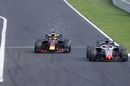 Daniel Ricciardo as he overtakes Romain Grosjean