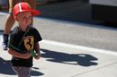 Kimi Raikkonen's son Robin runs through the paddock