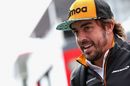 Fernando Alonso walks in the Paddock