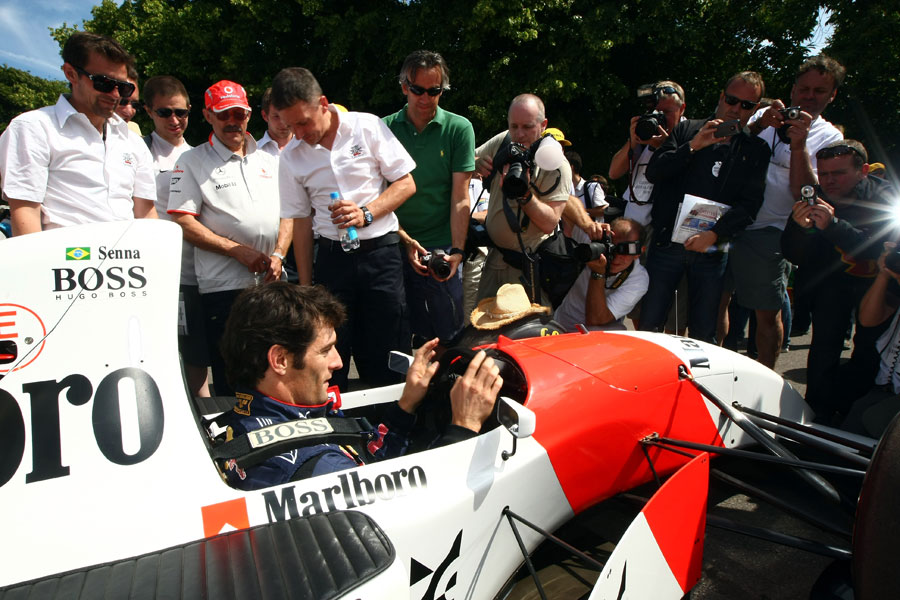 Mark Webber sits in the McLaren of Aryton Senna during day two at Goodwood