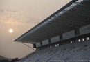 The sun sets over the main grandstand at the new Korean Grand Prix circuit