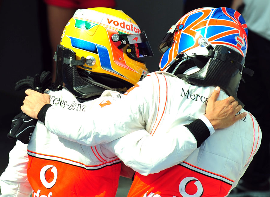 Jenson Button congratulates Lewis Hamilton on his victory